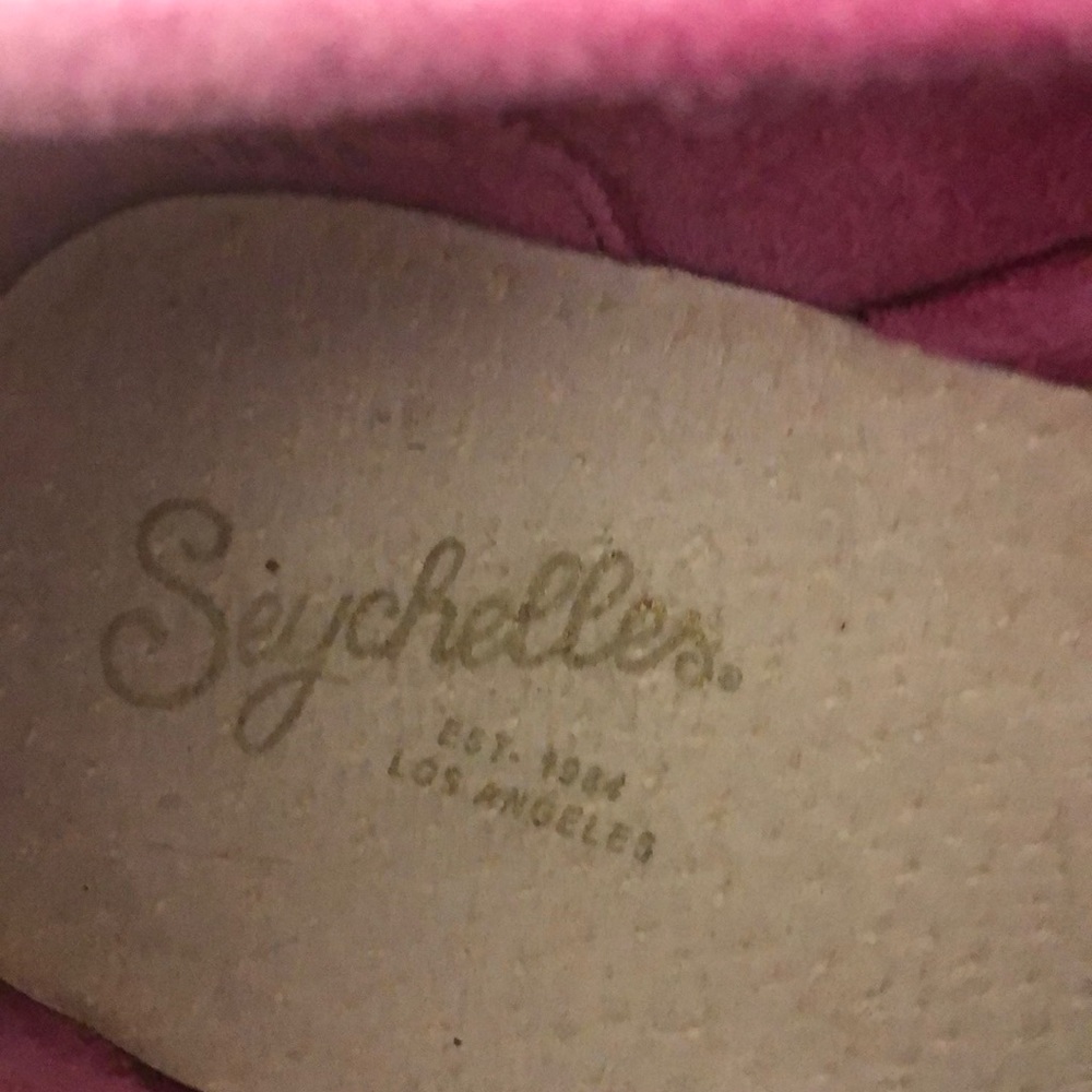 Pink suede shoes w/ ties. These shoes belong on an island.